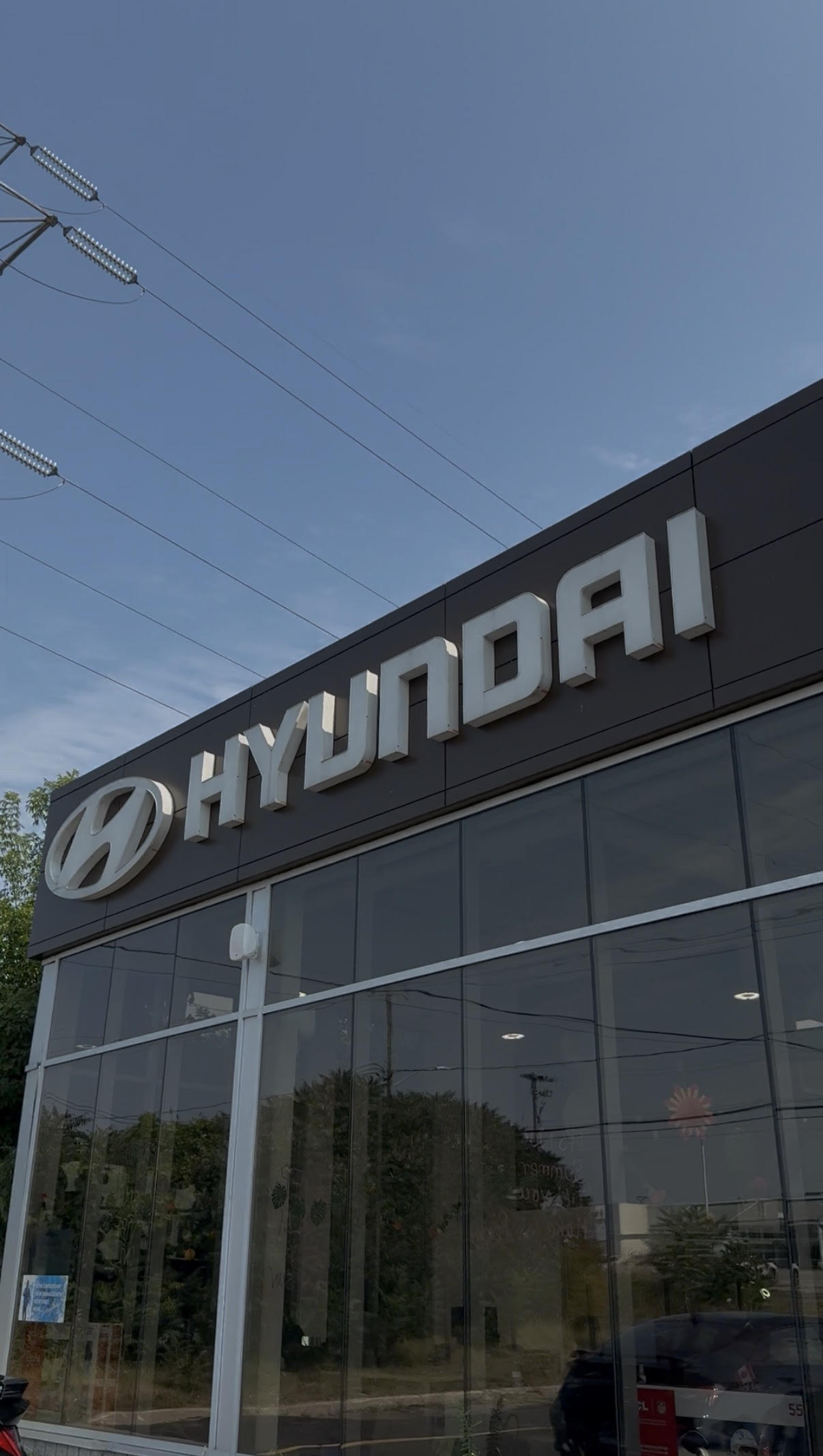 Technician measuring glass for window film